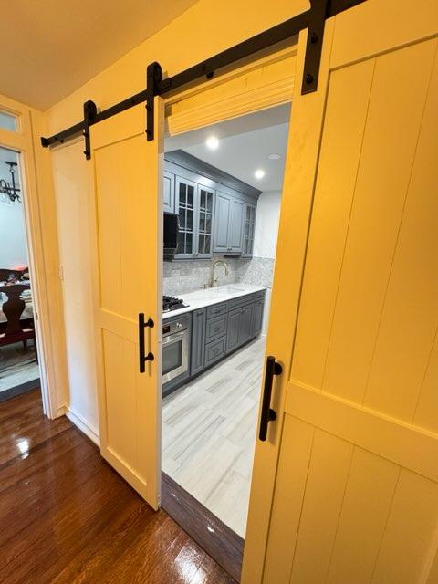 Galley Kitchen Transformation Using Barn Doors in Astoria, Queens